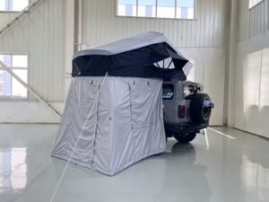 Soft shell rooftop tent with extended annex room for camping