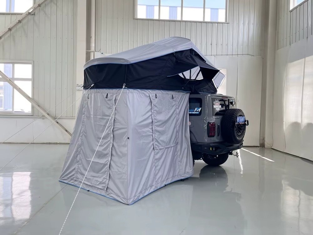 Soft shell rooftop tent with extended annex room for camping