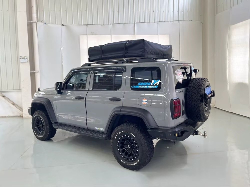 Foldable soft shell rooftop tent in closed travel position