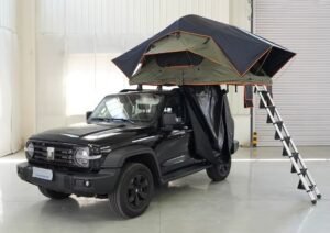 4x4 vehicle with rooftop tent and telescopic aluminum ladder