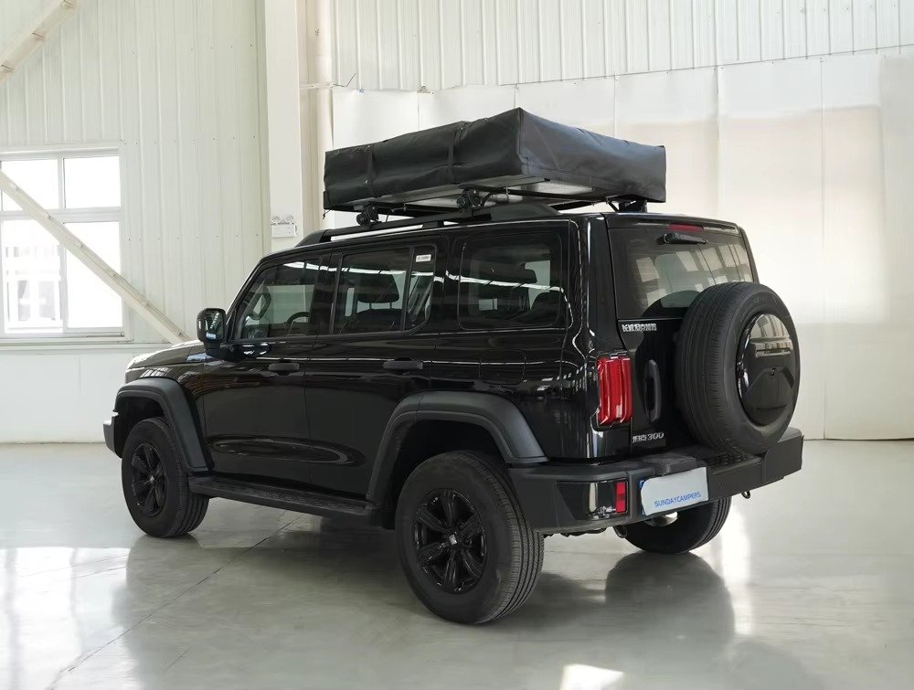 Compact folded rooftop tent mounted on 4x4 vehicle