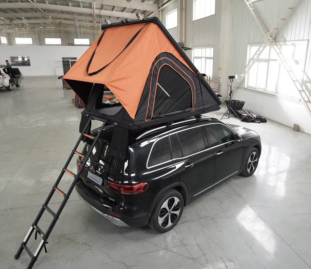 SUV rooftop tent open for outdoor camping with access ladder