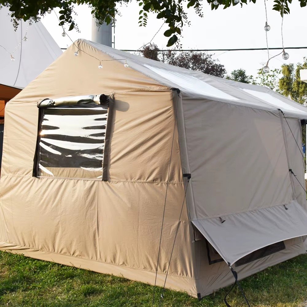 Beige four-season camping tent viewed from the side, with a clear window and an extended lower flap.