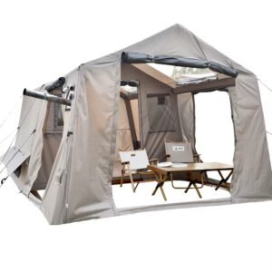 Large gray camping tent with its front panels open and camp chairs and a table inside.