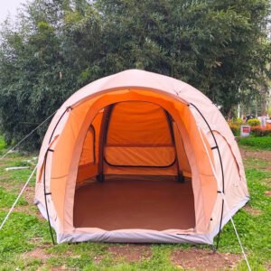 Front view of a beige dome camping tent with the entrance open and interior visible
