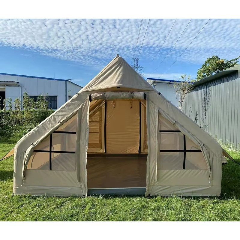 Front view of a beige cabin tent with an open doorway and mesh side panels.