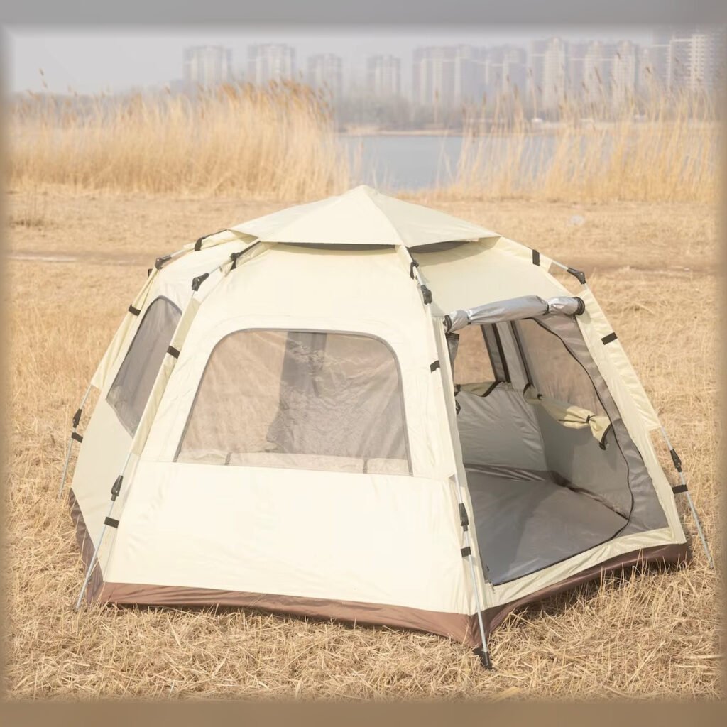 Beige hexagonal camping tent with the front entrance open.