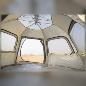 Interior view of a beige pop-up camping tent showing the roof frame, mesh windows, and floor.