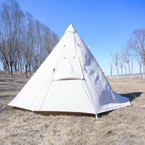 Beige teepee camping tent set up in an open field beneath a clear blue sky.