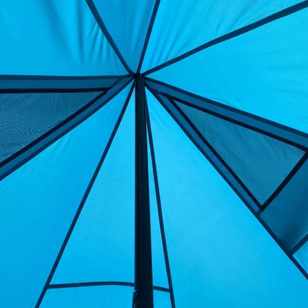 Blue camping tent outdoor setup with support ropes and stable shelter structure