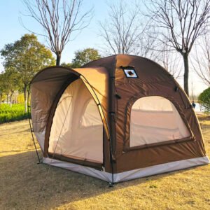 Brown tent with an extended front awning among trees