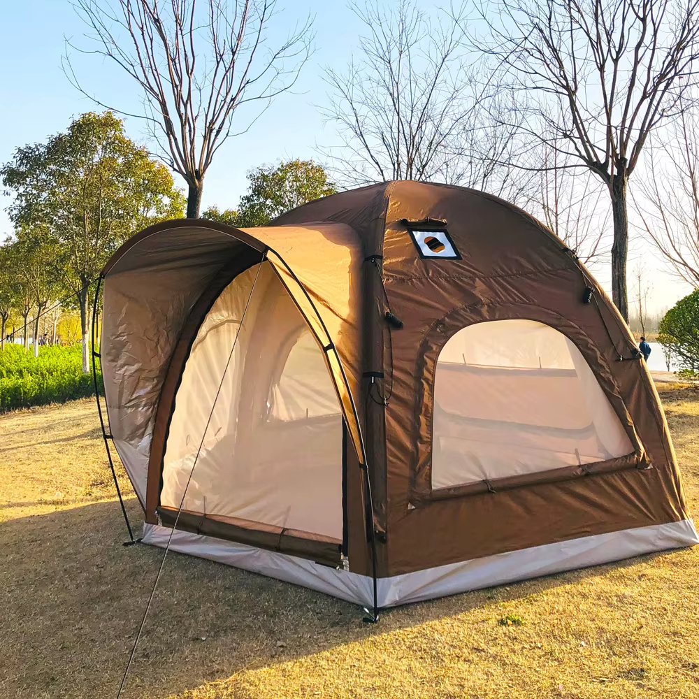 Brown tent with an extended front awning among trees