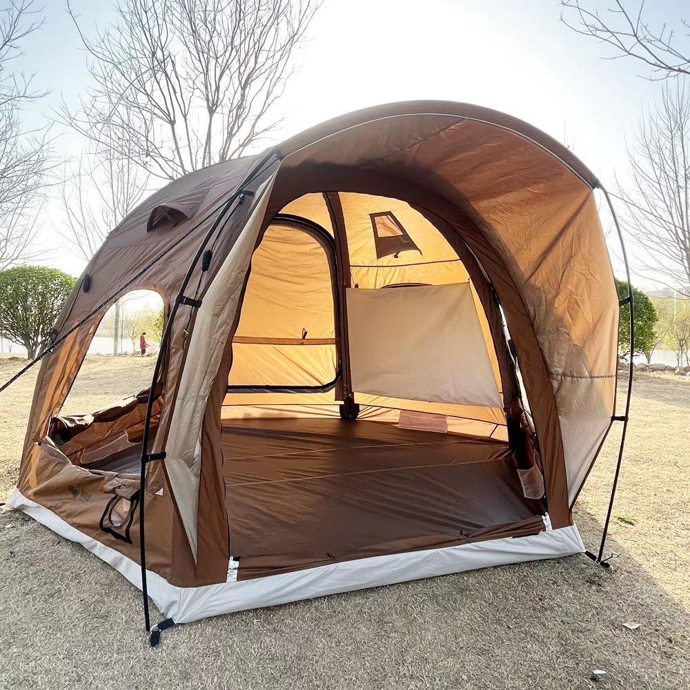Open brown tent showing its interior in an outdoor setting