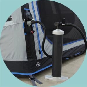 Floor pump connected to the inflation valve of a gray and blue inflatable camping tent.