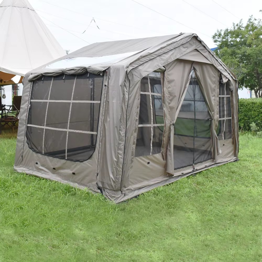 Gray-beige tent showing a wide mesh window and open entrance on grass