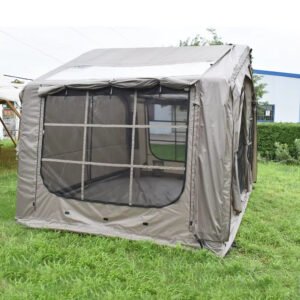 Close side view of a large mesh window panel on a gray-beige tent