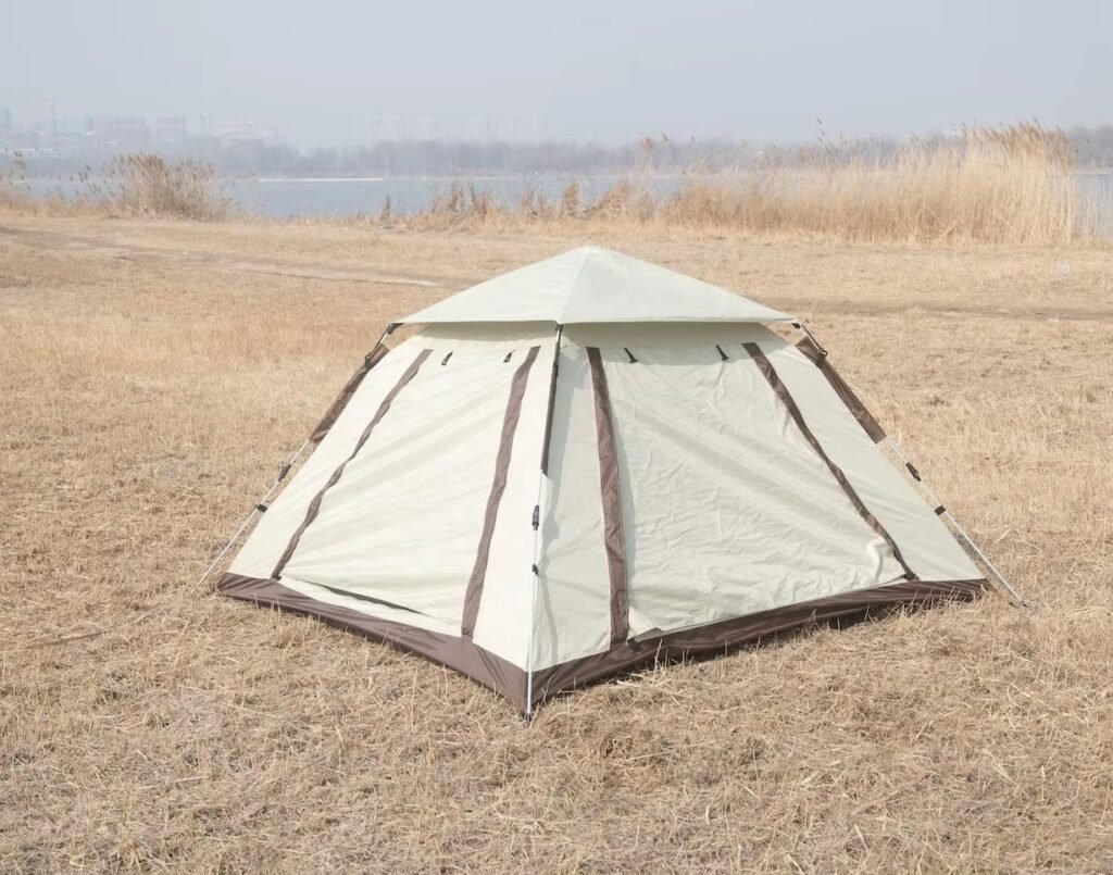 Pop-up camping tent shown closed with full rainfly coverage