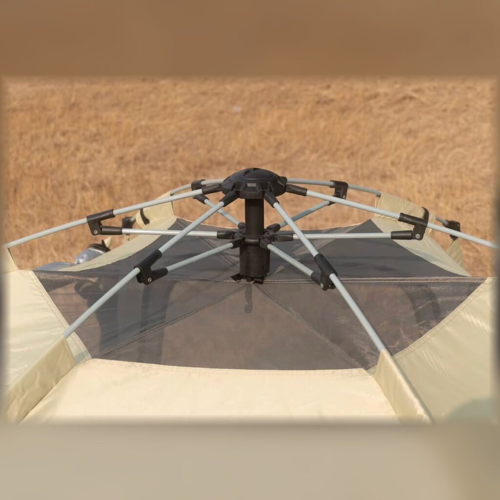 Close-up of the folding frame mechanism on a pop-up tent roof.