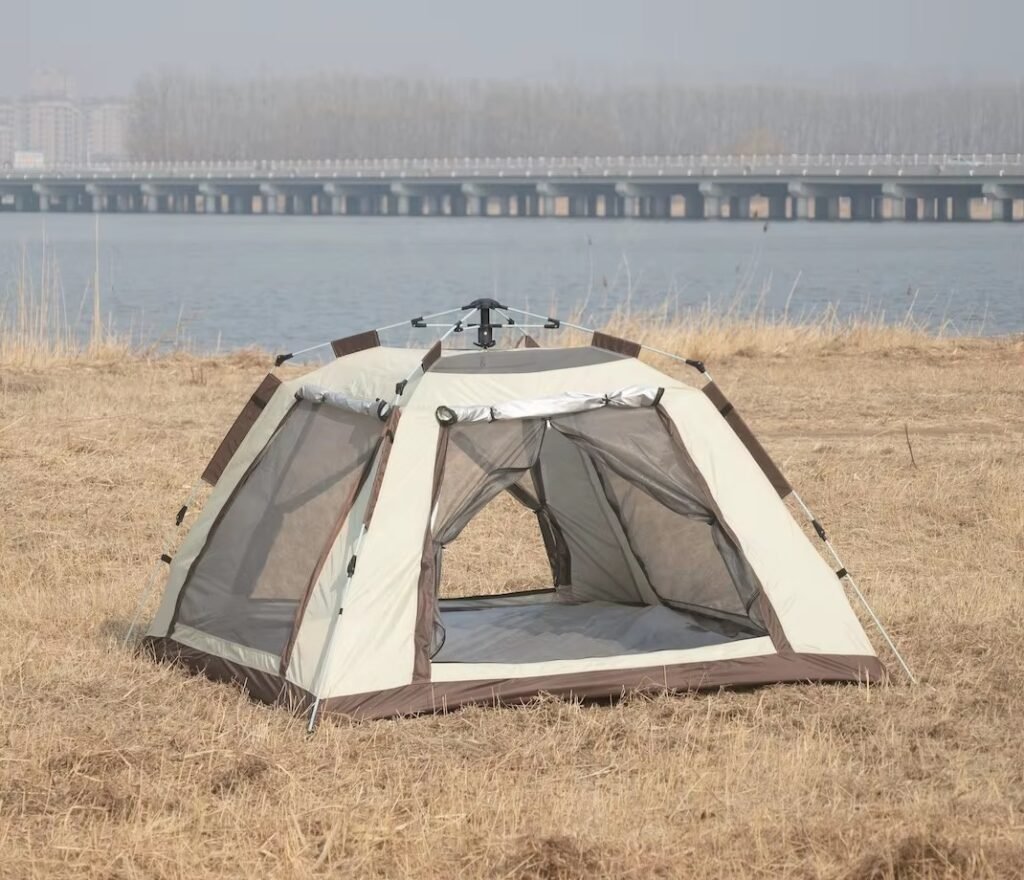 Waterproof pop-up camping tent with open front door and mesh windows